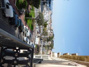 a city street with cars parked on the side of a building at Arthur Properties Croisette in Cannes