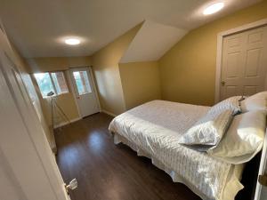 a small bedroom with a bed and a door at 3-Bedroom Apartment in 108 Mile Ranch