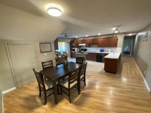 a dining room and kitchen with a table and chairs at 3-Bedroom Apartment in 108 Mile Ranch