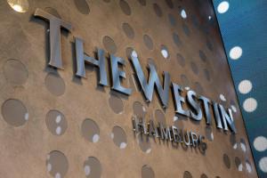 a sign for the entrance to the hiltonnesota building at The Westin Hamburg in Hamburg