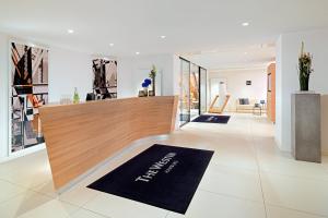 a lobby of a store with a reception desk and a lobby at The Westin Hamburg in Hamburg