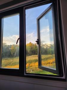 Fotografija v galeriji nastanitve Tiny Home - Redbird v mestu Hartley