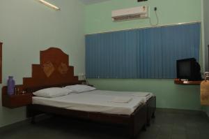 Postel nebo postele na pokoji v ubytování VALLI HOTEL