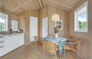 a kitchen and dining room with a table and chairs at 2 Bedroom Gorgeous Home In Humble in Humble