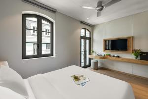 TV a/nebo společenská místnost v ubytování Laputa Hotel Phu Quoc