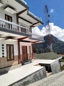 a house with a view of a mountain at Bromo Seruni Astungkara Homestay in Probolinggo