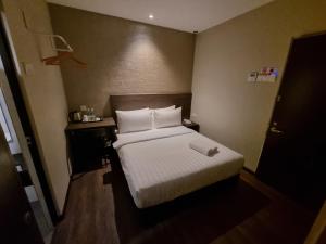Voodi või voodid majutusasutuse MIICO Hotel @ Mount Austin toas