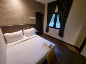 Voodi või voodid majutusasutuse MIICO Hotel @ Mount Austin toas