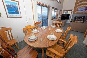 a dining room with a wooden table and chairs at 1228 Timber Lane home in South Lake Tahoe