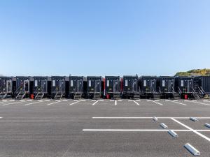 a parking lot filled with rows of containers at HOTEL R9 The Yard Iizuka in Iizuka