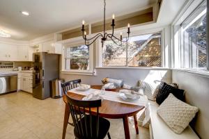 a kitchen and dining room with a table and chairs at Pet Friendly and Historic Prescott Home with Fire Pit! in Prescott