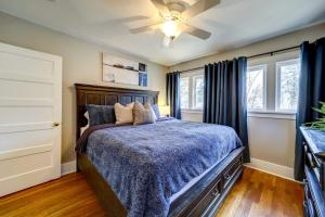 a bedroom with a bed and a ceiling fan at Historic Prescott Home with Yard and Fire Pit! in Prescott