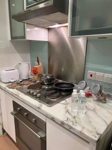 a kitchen counter top with a stove top oven at Perfect Marina Stay@ Strait Quay /w Big Balcony + Carpark in Bagan Jermal