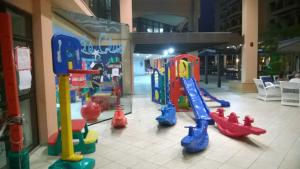 a group of childrens play equipment in a shopping mall at Jurerê Beach Village Studios Para Temporada in Florianópolis