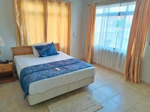PRESTIGE Guesthouse ,Ksi客房内的一张或多张床位