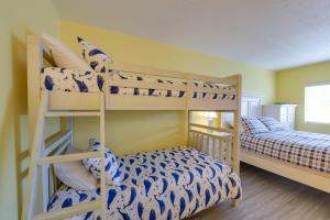a bunk bed room with two bunk beds in it at Ocean City Condo with Pool Walk to Boardwalk! in Ocean City