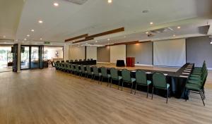 a conference room with a long table and chairs at Seasons Golf, Leisure, Spa in Hartbeespoort +214 photos