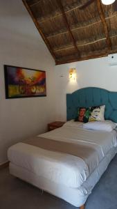 Postel nebo postele na pokoji v ubytování Casa Frida + 37 fotografií