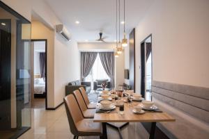 a dining room with a table and chairs at Opus KL Residences by Premium Hospitality in Kuala Lumpur