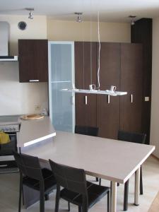 a kitchen with a large table and chairs at Apartament w Ustroniu in Ustroń