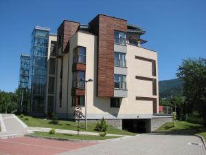 a building on the side of a street at Apartament w Ustroniu in Ustroń