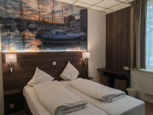 Postel nebo postele na pokoji v ubytování Hotel Albert II Oostende
