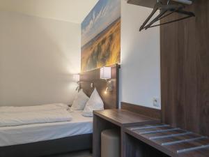 Postel nebo postele na pokoji v ubytování Hotel Albert II Oostende