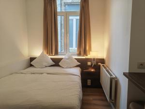 Postel nebo postele na pokoji v ubytování Hotel Albert II Oostende