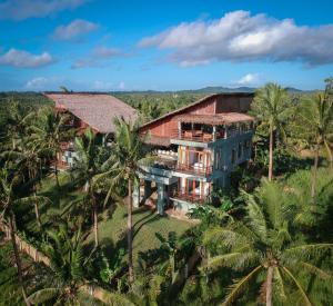 an aerial view of a house with palm trees at Tanaw Villas in General Luna