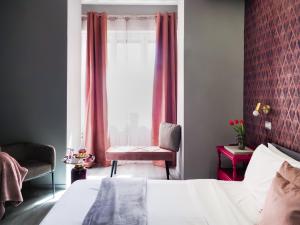 Postel nebo postele na pokoji v ubytování C'est La Vie Suites
