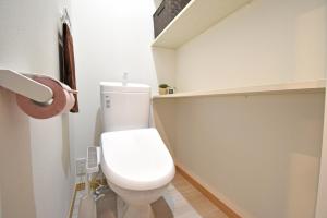 a bathroom with a white toilet in a room at ID STAY Ikebukuro 済 in Tokyo