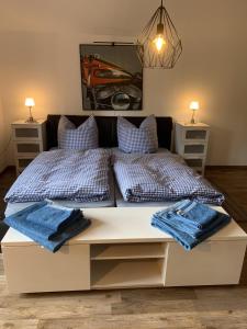 a bedroom with two beds and two night stands at Haus Fremerey in Krün