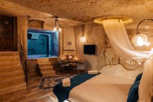 Postel nebo postele na pokoji v ubytování Bayar Cave Suites