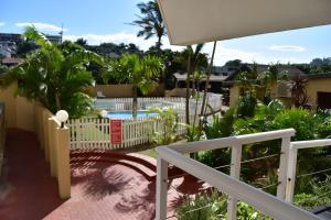 a balcony with a pool and a fence at Apartment with Sea View at Margate, South Coast in Margate