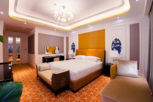 Postel nebo postele na pokoji v ubytování Continental Xin Hao Hotel and Resort 洲际新濠酒店