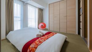 Una cama o camas en una habitación de 匯金北池袋ビル