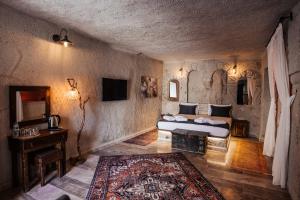 Postel nebo postele na pokoji v ubytování Bayar Cave Suites