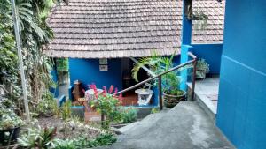 Um jardim em Pousada Casa Azul