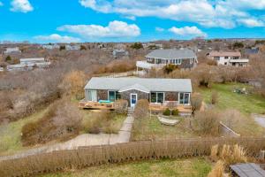 an aerial view of a house with a fence at Don't Ditch Your Plains in Montauk