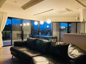 Posezení v ubytování CONDOMINIUM 紅-BIN-
