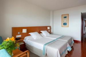 Кровать или кровати в номере Parador de Nerja
