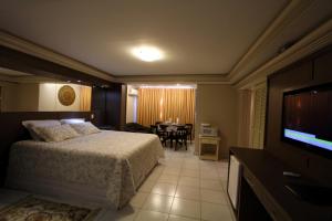 聖若昂－德雷的住宿－維琴察公寓式酒店，酒店客房,配有床和电视