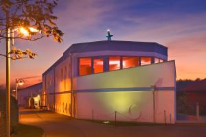 a building with a cross on top of it at Hotel & Restaurant Hanse Kogge in Ostseebad Koserow