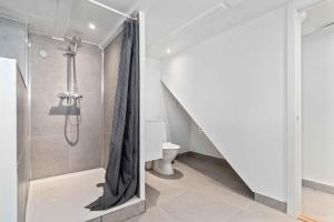 a bathroom with a shower and a toilet at A Lovely Holiday Home In Quiet, Scenic Surroundings in Rønne