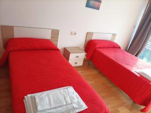 Ένα ή περισσότερα κρεβάτια σε δωμάτιο στο Apartamentos Sanxenxo 3000