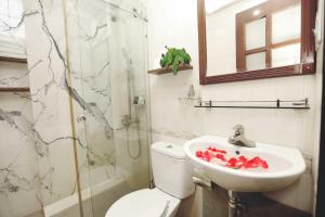 a bathroom with a toilet and a sink at Hanoi Golden Lotus Hotel & Spa in Hanoi +21 photos