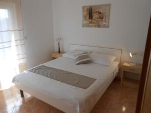 Posteľ alebo postele v izbe v ubytovaní Apartments Luvi