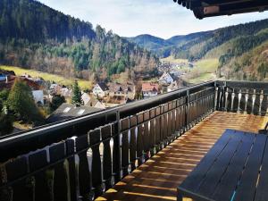 a view from the balcony of a house with a bench at Haus Schwarzwaldblick in Hornberg