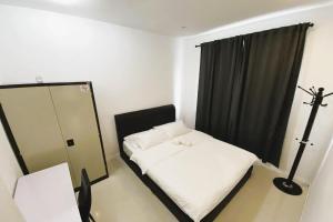Postel nebo postele na pokoji v ubytování Island Hostel Bayan Lepas Airport