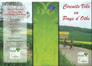 two people riding a bike down a dirt road at Maison d'Othe in Saint-Mards-en-Othe